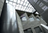 Elevator shaft in Federation Court, NGV International, with new glass ceiling and original bluestone walls