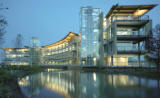 This photo shows the stormwater runoff pond and the building view from the west.